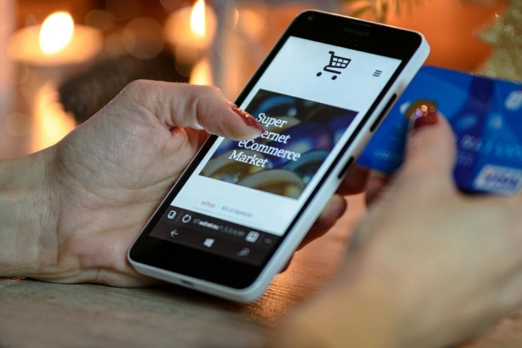A hand on mobile scrolling an ecommerce store